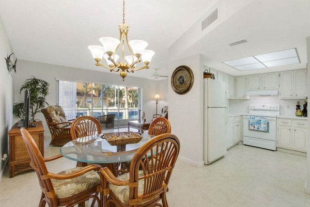 dining space with visible vents and an inviting chandelier