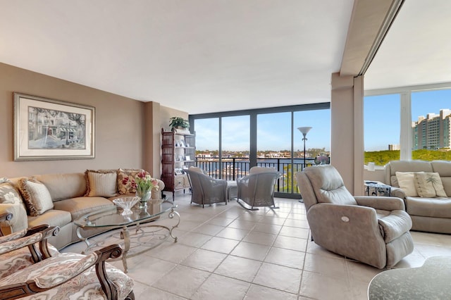 living area with expansive windows, light tile patterned floors, and a view of city