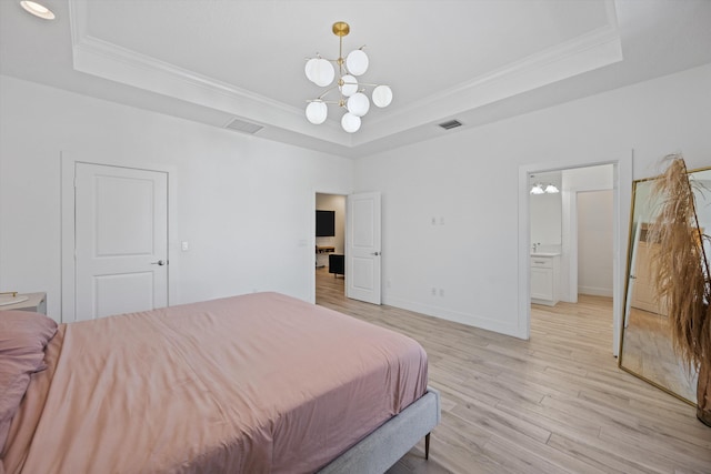 bedroom featuring ornamental molding, a raised ceiling, and light wood-style flooring