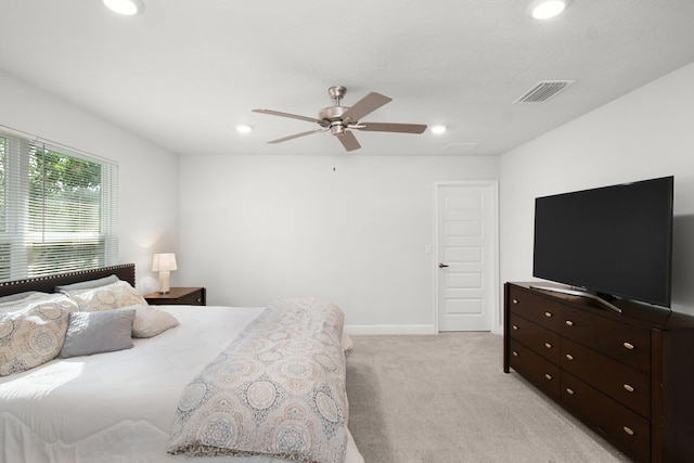 bedroom with recessed lighting, visible vents, a ceiling fan, and light colored carpet