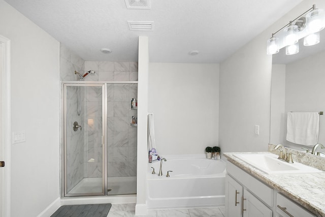 bathroom with marble finish floor, a stall shower, a garden tub, and visible vents