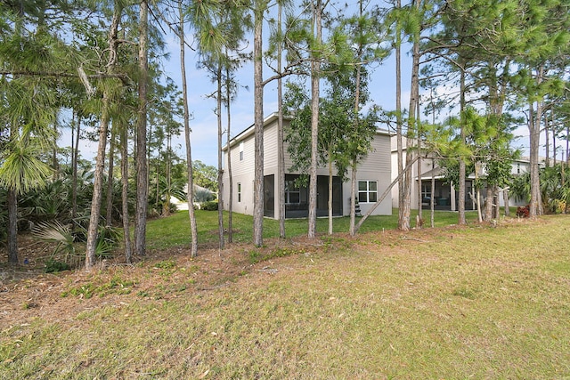 rear view of property with a lawn