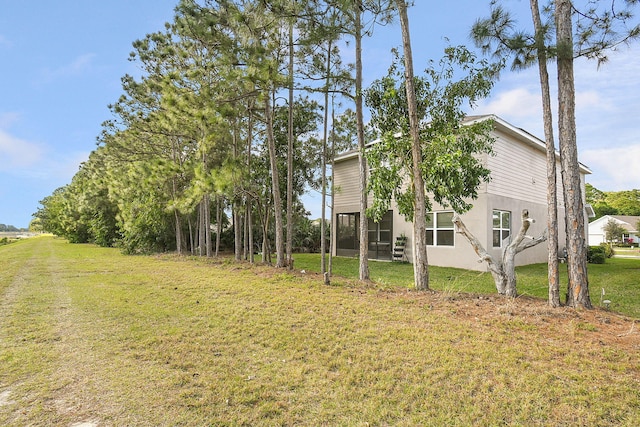 view of home's exterior with a yard and stucco siding