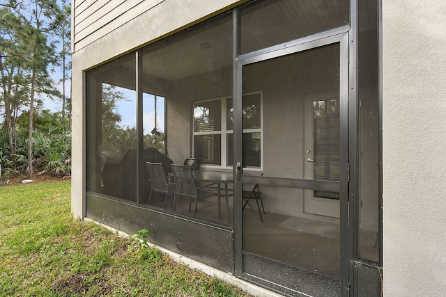 view of patio / terrace with a sunroom