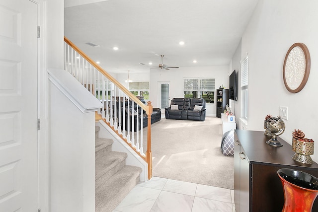 stairway featuring carpet, a ceiling fan, and recessed lighting