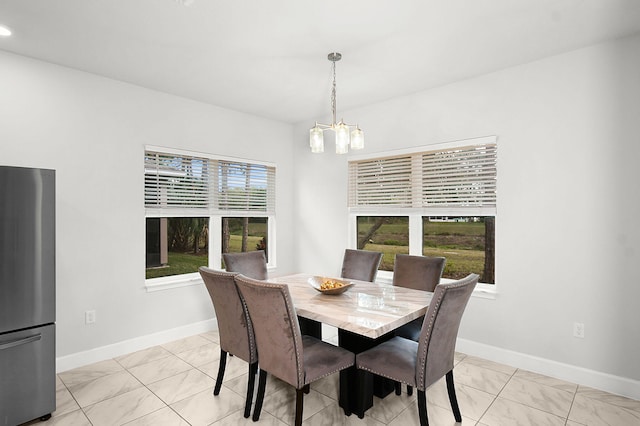 dining area featuring baseboards, a chandelier, and recessed lighting