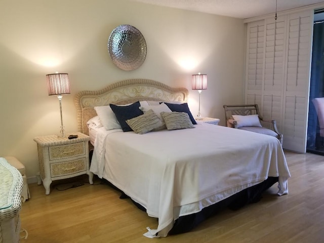 2424 N Federal Hwy Unit 106, Boynton Beach, FL 33435 - bedroom featuring wood finished floors