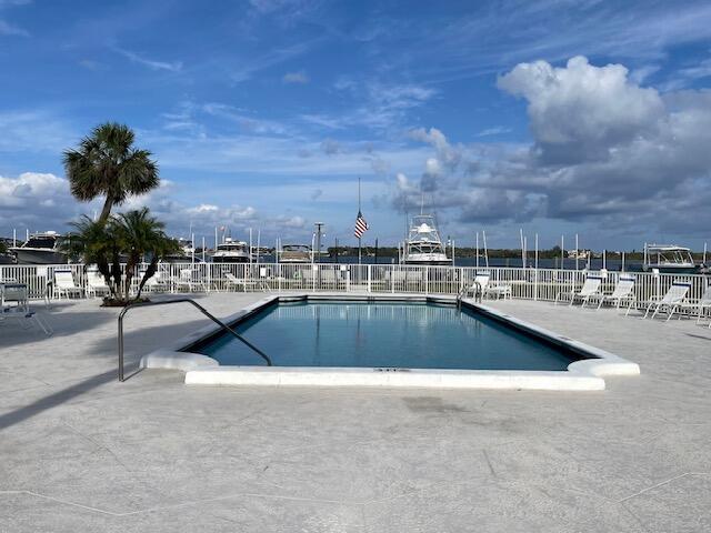 2424 N Federal Hwy Unit 106, Boynton Beach, FL 33435 - community pool featuring fence and a patio area