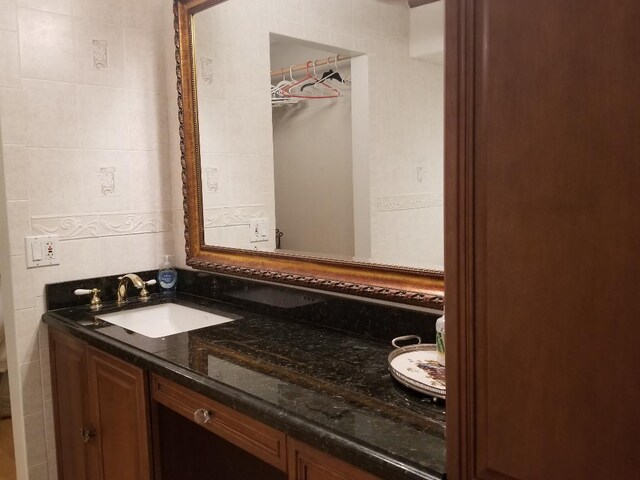 2424 N Federal Hwy Unit 106, Boynton Beach, FL 33435 - bathroom with tile walls and vanity