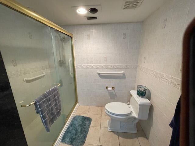 2424 N Federal Hwy Unit 106, Boynton Beach, FL 33435 - bathroom featuring visible vents, tile patterned floors, a stall shower, and toilet