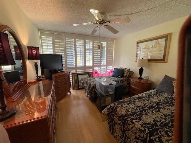 2424 N Federal Hwy Unit 106, Boynton Beach, FL 33435 - bedroom with wood finished floors and a textured ceiling