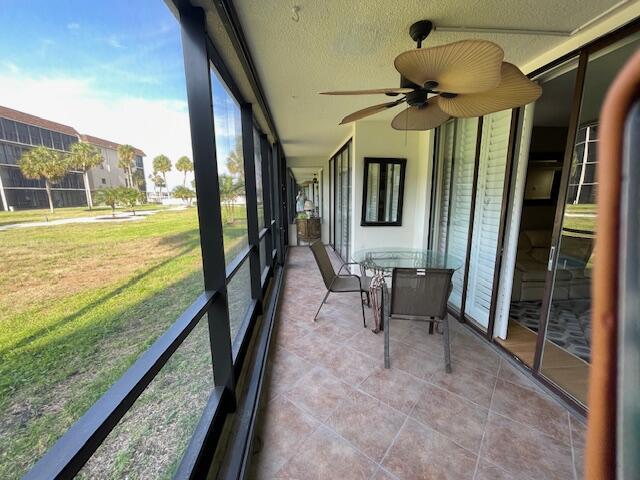 2424 N Federal Hwy Unit 106, Boynton Beach, FL 33435 - sunroom with a ceiling fan