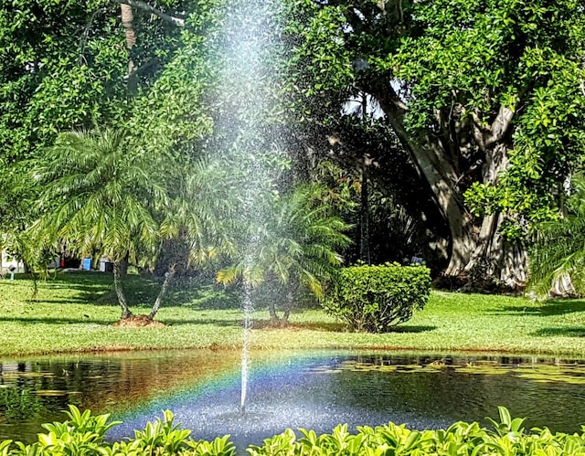 2424 N Federal Hwy Unit 106, Boynton Beach, FL 33435 - view of community with a water view and a yard