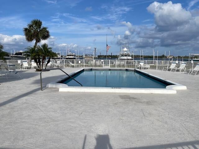 2424 N Federal Hwy Unit 106, Boynton Beach, FL 33435 - pool with fence and a patio