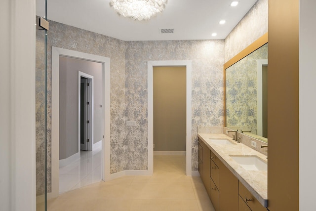 bathroom with tile patterned flooring, visible vents, and a sink