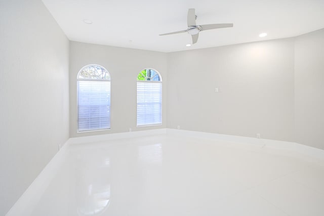 empty room featuring ceiling fan and recessed lighting