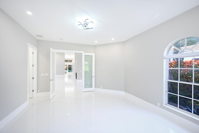 unfurnished room with visible vents and recessed lighting