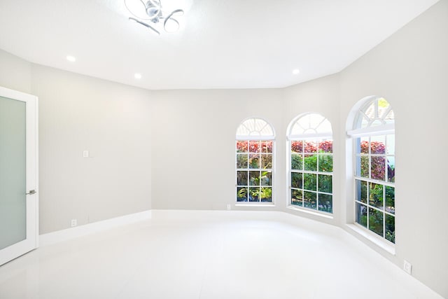 spare room with recessed lighting and a healthy amount of sunlight