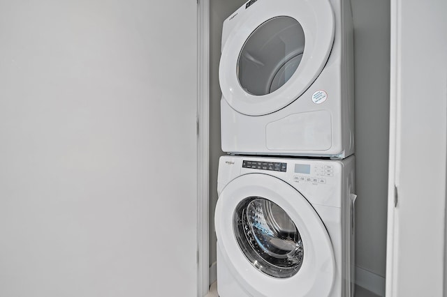 laundry room featuring laundry area and stacked washing maching and dryer