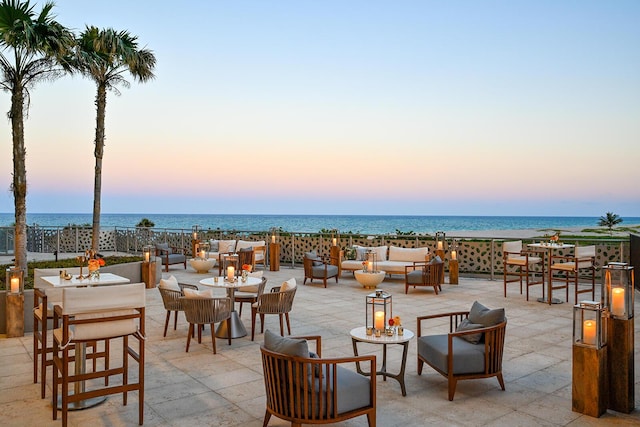 view of patio / terrace featuring a water view and an outdoor living space