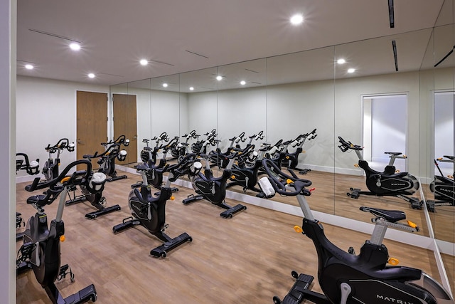 gym featuring recessed lighting and wood finished floors