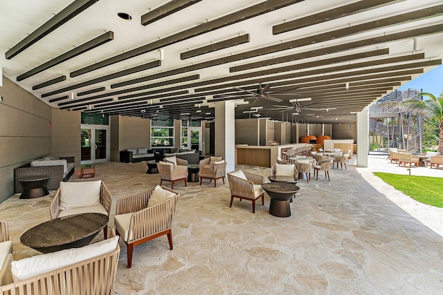 view of patio with outdoor lounge area and a ceiling fan