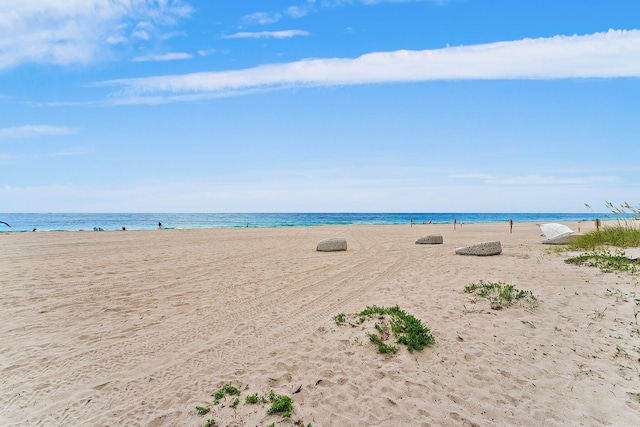 view of water feature with a beach view