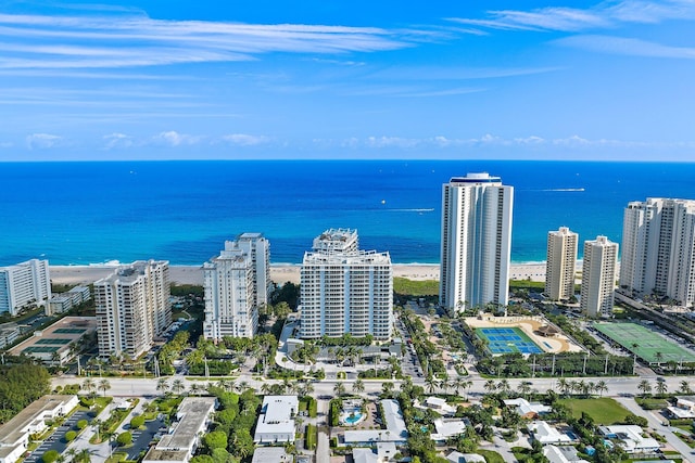 drone / aerial view featuring a water view and a city view