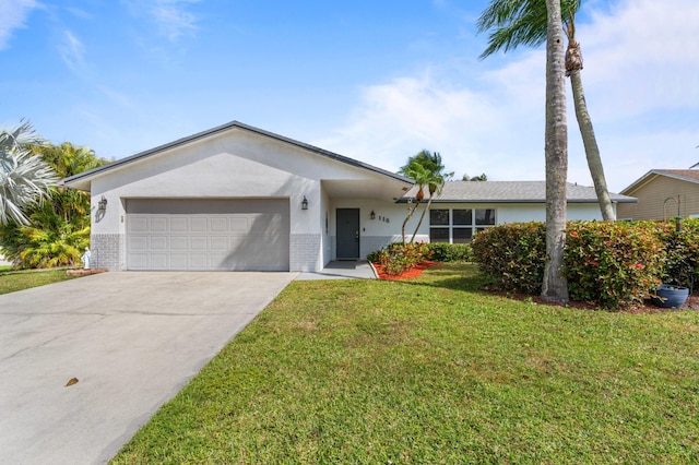 single story home featuring a garage, brick siding, concrete driveway, stucco siding, and a front yard