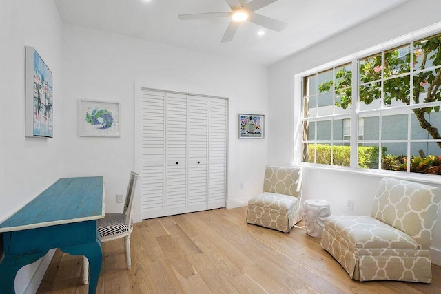 interior space with ceiling fan and wood finished floors