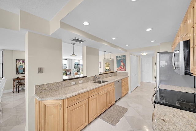 kitchen with visible vents, appliances with stainless steel finishes, light stone countertops, light brown cabinetry, and a sink