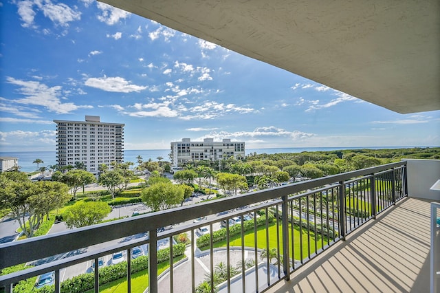 balcony with a water view and a city view