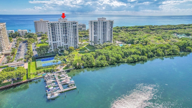 birds eye view of property with a view of city and a water view