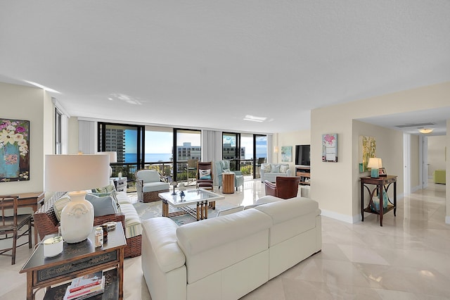 living area with expansive windows and baseboards