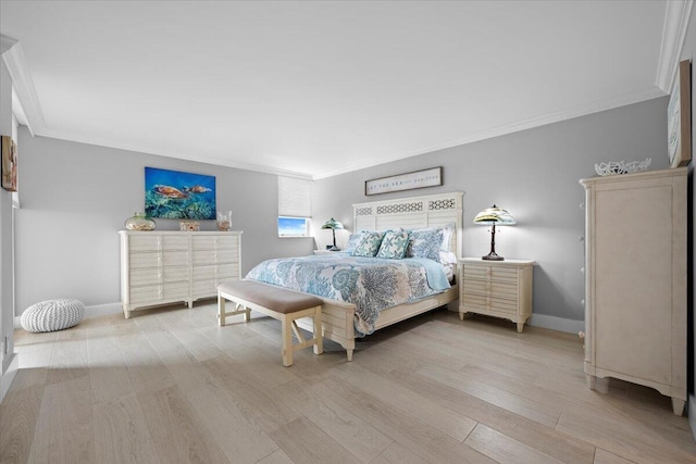 bedroom with crown molding, baseboards, and light wood-style floors