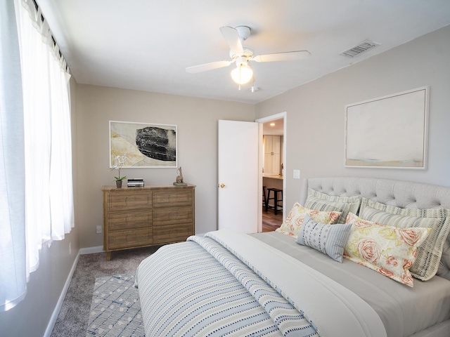 bedroom featuring baseboards, visible vents, ceiling fan, and carpet flooring