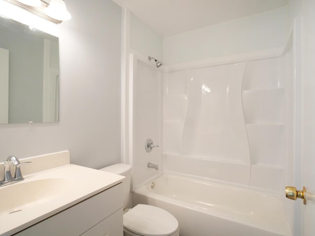 bathroom featuring  shower combination, vanity, and toilet