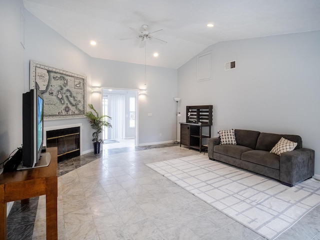 living area with recessed lighting, visible vents, a glass covered fireplace, ceiling fan, and baseboards