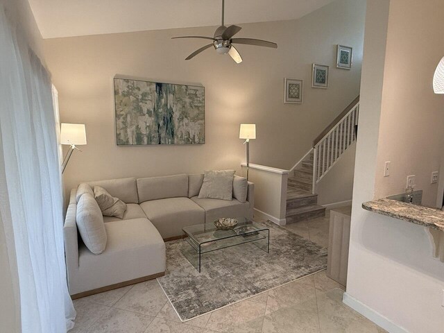 living room featuring ceiling fan and visible vents