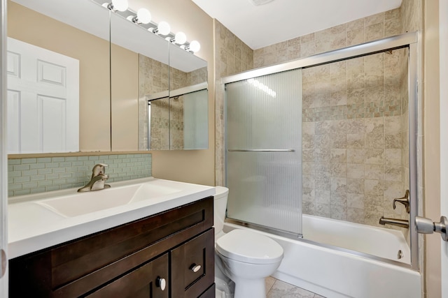 19203 Glenmoor Dr, West Palm Beach, FL 33409 - bathroom featuring vanity, bath / shower combo with glass door, and backsplash