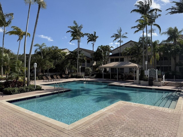 community pool with a patio area