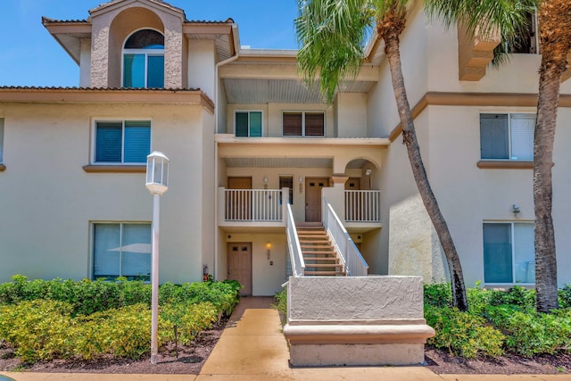 19203 Glenmoor Dr, West Palm Beach, FL 33409 - view of building exterior featuring stairway