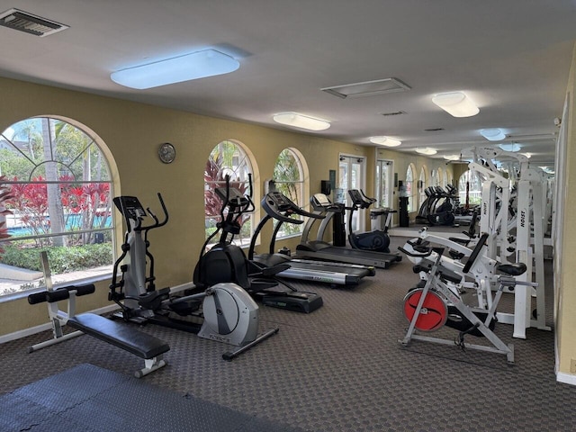 gym featuring visible vents and baseboards