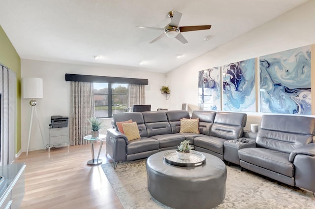 living room with lofted ceiling, a ceiling fan, and wood finished floors