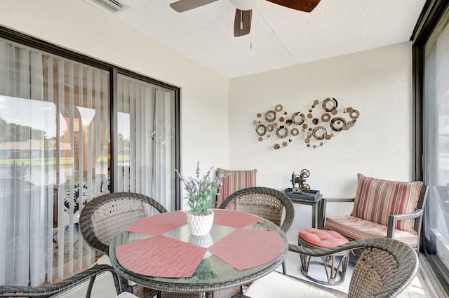 dining area with a ceiling fan, visible vents, and a textured ceiling