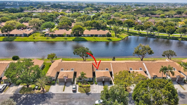 birds eye view of property with a residential view and a water view