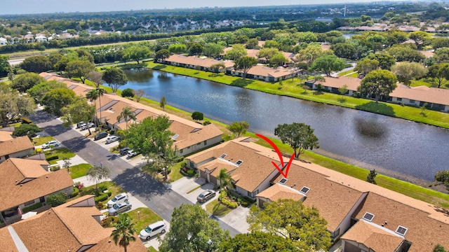 aerial view with a residential view and a water view