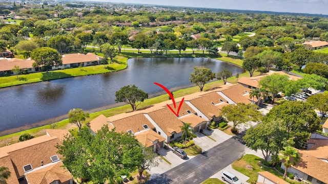 bird's eye view with a water view and a residential view