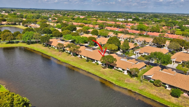 bird's eye view featuring a water view and a residential view