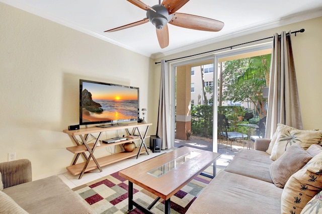 living room with ornamental molding, a ceiling fan, and tile patterned floors